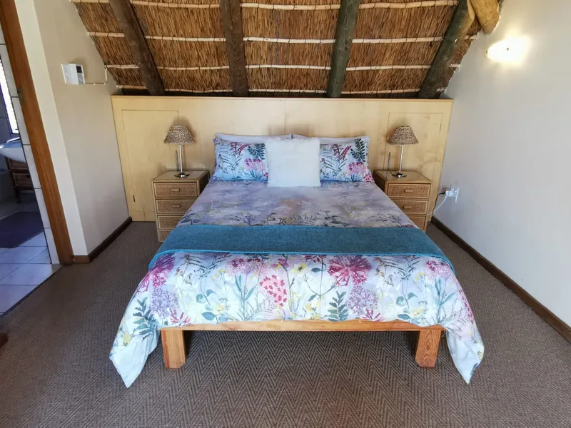 Master bedroom with thatched ceiling