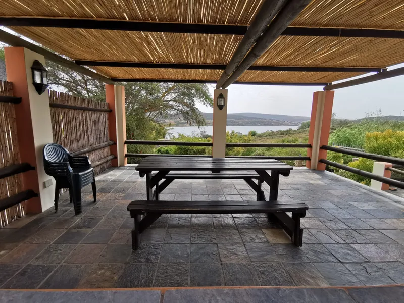 Covered patio with scenic dam views