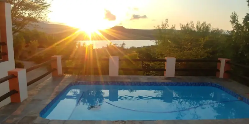 Sunset over the dam seen from the covered house patio